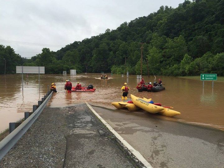 Emergency crews take out boats on a flooded I-79 at the Clendenin Exit, after the state was pummeled by up to 10 inches of rain on Thursday, causing rivers and streams to overflow into neighboring communities, in Kanawha County, West Virginia, June 24, 2016.