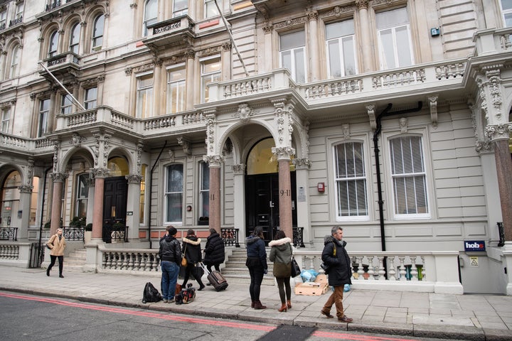 Journalists cluster outside the offices of Orbis Business Intelligence in London, the company co-owned by former MI6 spy Chri