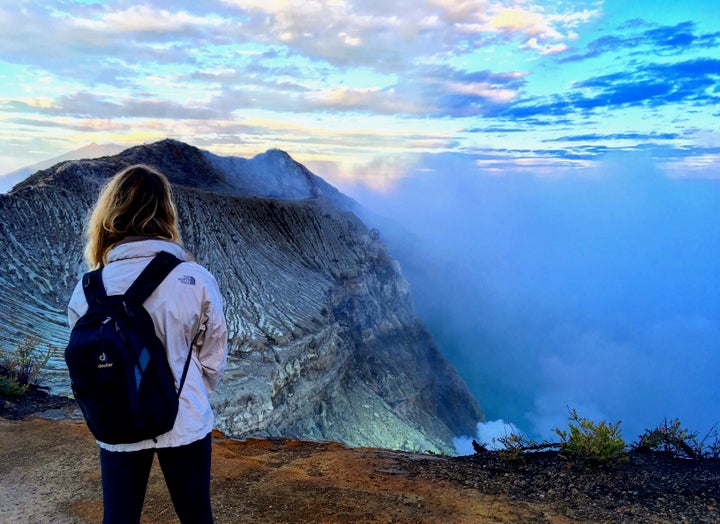 Travel writer Nicole Canning watches the sun rise over the Ijen Crater, Java Island, Indonesia. 