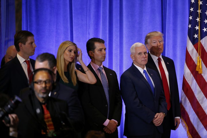 U.S. President-elect Donald Trump stands with Vice President-elect Mike Pence, his sons Donald Trump Jr. and Eric Trump and d
