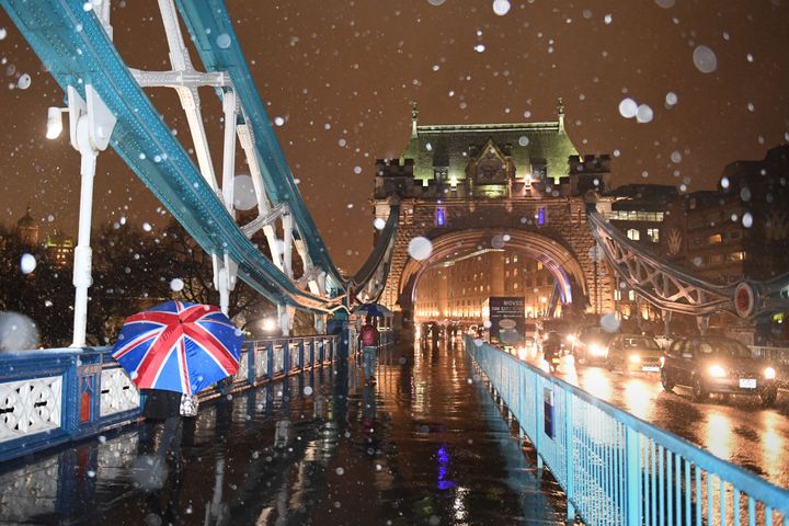 Falling snow on Tower Bridge in London on Thursday