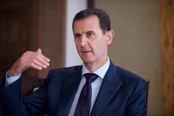 Syria's President Bashar al-Assad speaks during an interview with Australia's SBS News channel in this handout picture provid