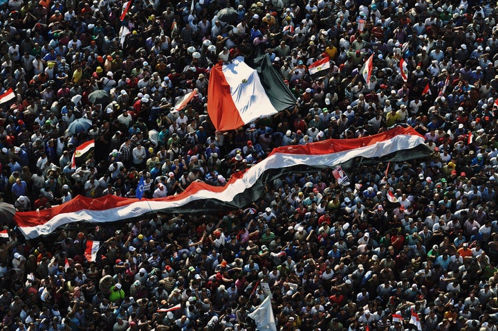 Muslim Brotherhood supporters celebrate in Cairo on June 24, 2012, as their candidate becomes the first democratically elected president in recent Egyptian history.