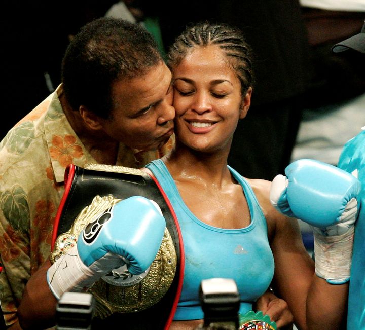 Laila Ali with her father, Muhammad Ali, at the MCI Center in Washington, June 11, 2005.