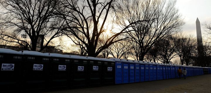 Rows of porta-potties, including some from "Don's Johns," at left, are seen ahead of President Obama's inauguration in 2009. The logos for Don's Johns are being covered in tape ahead of Donald Trump's inauguration next week.