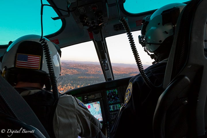 <p>Officers Flores (L) and Vinatieri (R) begin to orbit over a vehicle accident.</p>