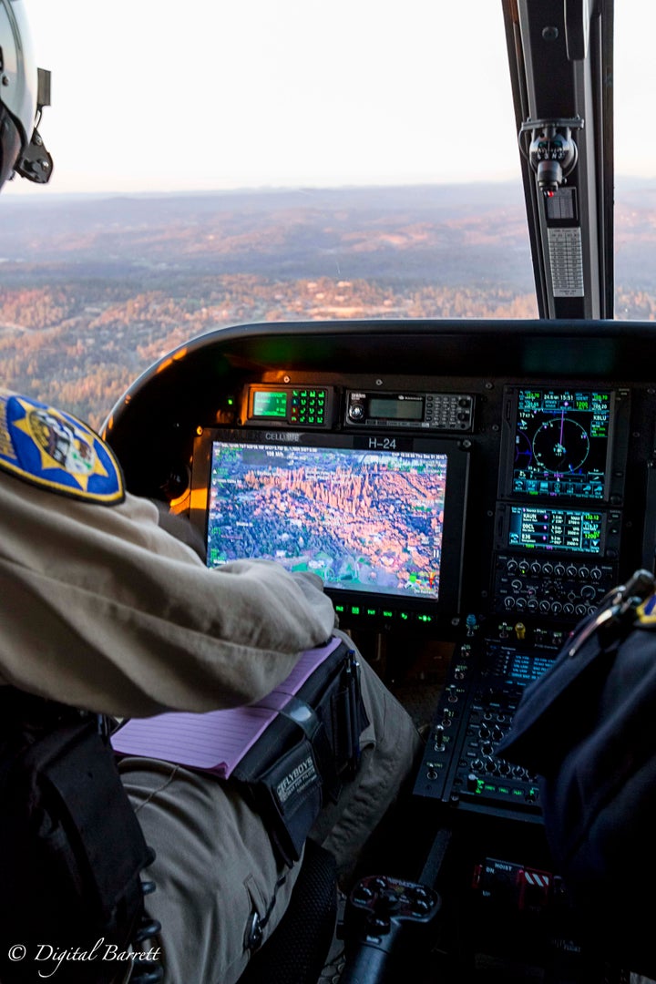 <p>Officer Flores cues up his high resolution camera to assist patrol units at the scene of an accident.</p>