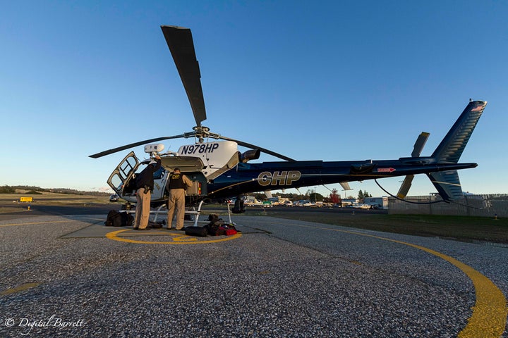 Officers Vinatieri and Flores check their equipment before take off.