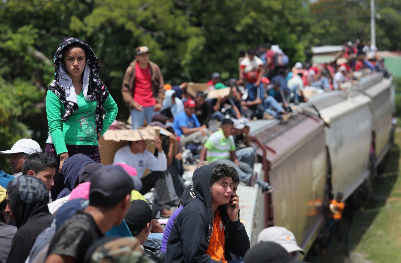 Thousands of Central Americans ride atop trains, known as La Bestia, or the Beast, through Mexico to reach the U.S. Aug. 6, 2013, near Juchitan, Mexico.