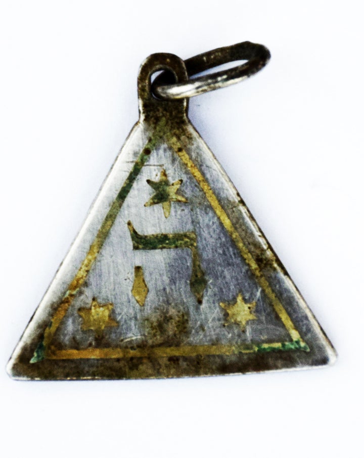 One side of the pendant discovered in the Sobibór Nazi death camp along the route that once led to the gas chambers.