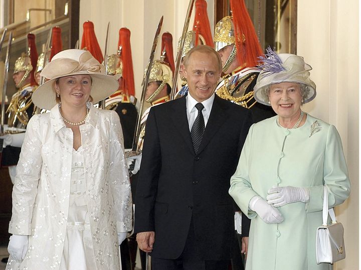<p>Putin and his wife Lyudmila meet with Queen Elizabeth II during their 2003 state visit to Great Britain. </p>