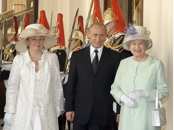 Putin and his wife Lyudmila meet with Queen Elizabeth II during their 2003 state visit to Great Britain. 