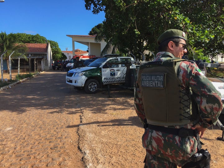 An agent of the Military Police stands guard at the Alcacuz Penitentiary Center near Natal, Rio Grande do Norte state, northeastern Brazil.