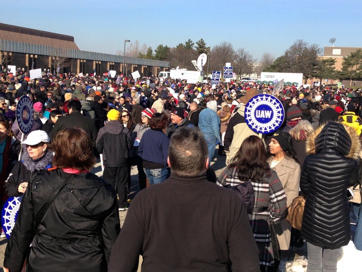 People wait for the start of a health care rally in Warren, Michigan, north of Detroit, on Sunday.