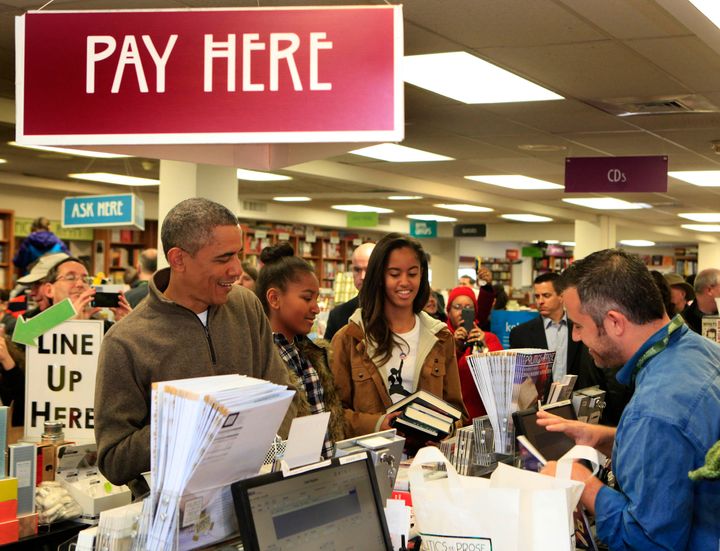 President Barack Obama and his daughters shopping at Politics and Prose, a bookstore in Washington, D.C., in 2014.