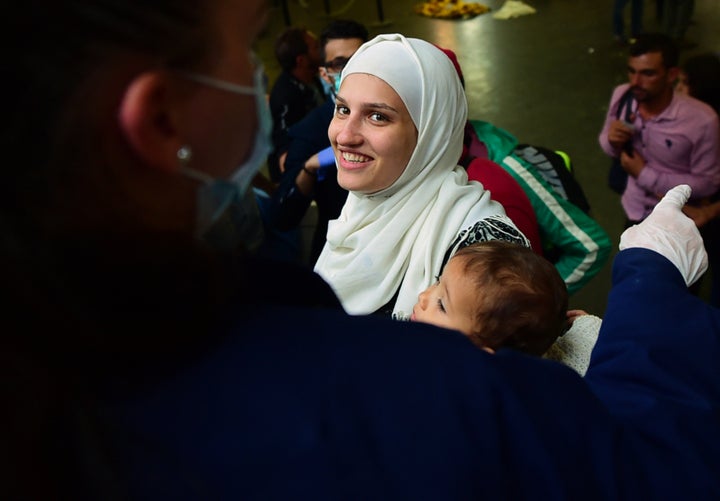 Migrants begin to file towards the platform of the Eastern Keleti station, after police opened the way in Budapest, Hungary, Sept. 12, 2015.