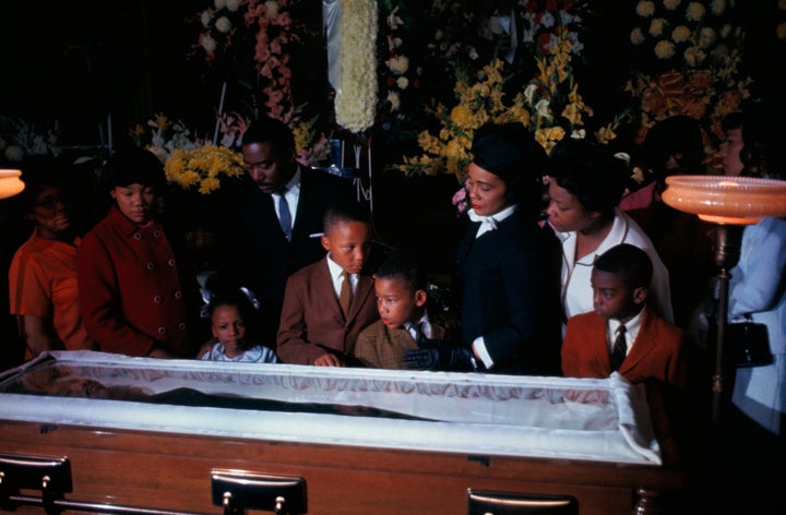 The family of slain civil rights leader Dr. Martin Luther King Jr. views his body as it lies in state at Sister's Chapel at Spelman College. Left to right: Yolanda, 12; Bernice, 5; Martin III, 11; and Dexter, 7, with Mrs. Martin Luther King Jr.