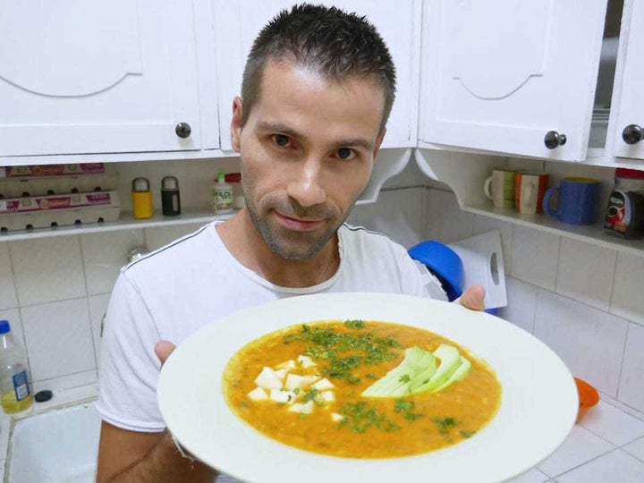 Sebastien with delicious freshly made plate of Ecuadorian locro de papa