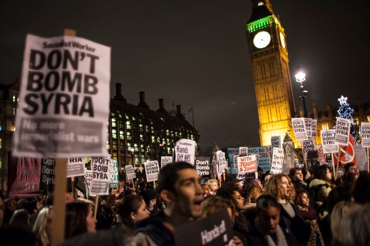 Dozens of anti-war protesters demonstrated against the vote outside Parliament in London.