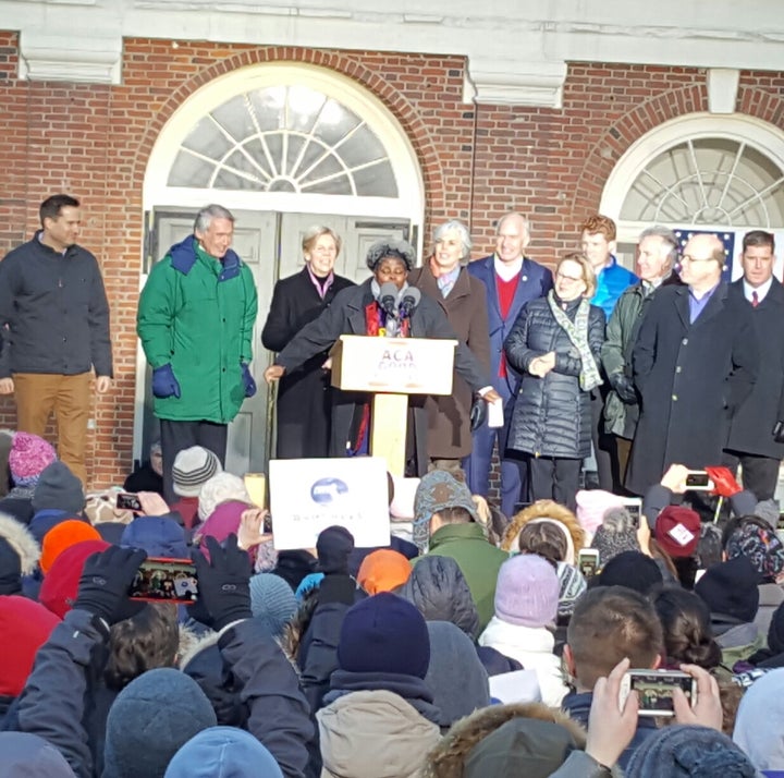 <p>Members of the Massachusetts delegation stand behind SEIU organizer Julie Gonzalez. Boston Mayor Martin J. Walsh is on right.</p>