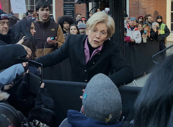 <p>Sen. Elizabeth Warren greets audience members at Jan. 15 Boston rally for the ACA.</p>