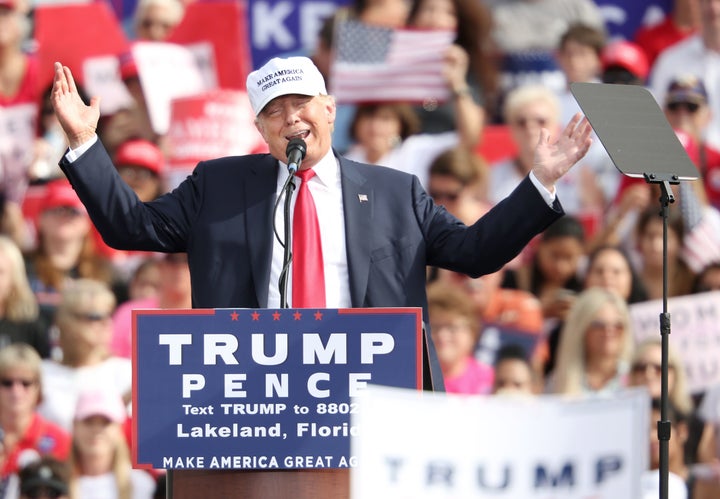 Republican presidential nominee Donald Trump addresses supporters during a campaign stop inside a hangar at Lakeland Linder Regional Airport in Lakeland, Florida on October 12, 2016.