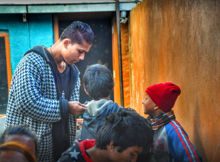 <p>Sujan Pariyar with street children.</p>