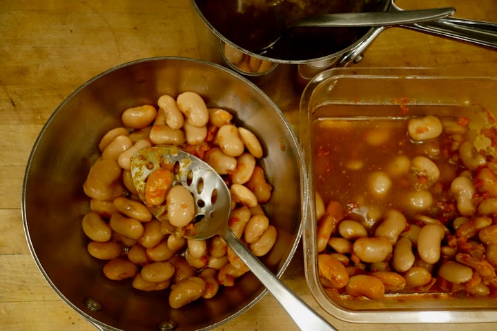 <p>Lifting the beans out of their broth leaves behind the hottest part</p>