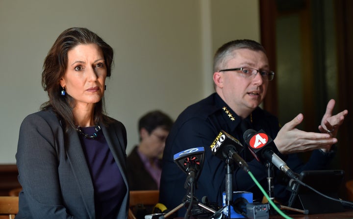 Oakland Mayor Libby Schaaf (L) and Oakland Police Chief Sean Whent (R) speak to members of the media about vandalism and property damage that ensued during yesterday's May Day protest in Oakland, California on May 2, 2015. Hundreds marched throughout the city on May 1 to mark International Workers' Day vandalizing store fronts, smashing windows and lighting a car on fire before eventually dispersing