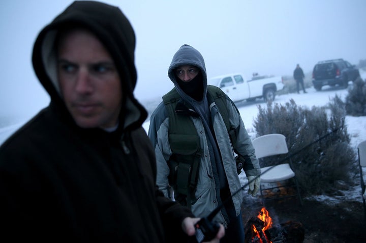 Members of an anti-government militia gather around a campfire outside of the Malheur National Wildlife Refuge Headquarters near Burns, Oregon, Jan. 7, 2016.