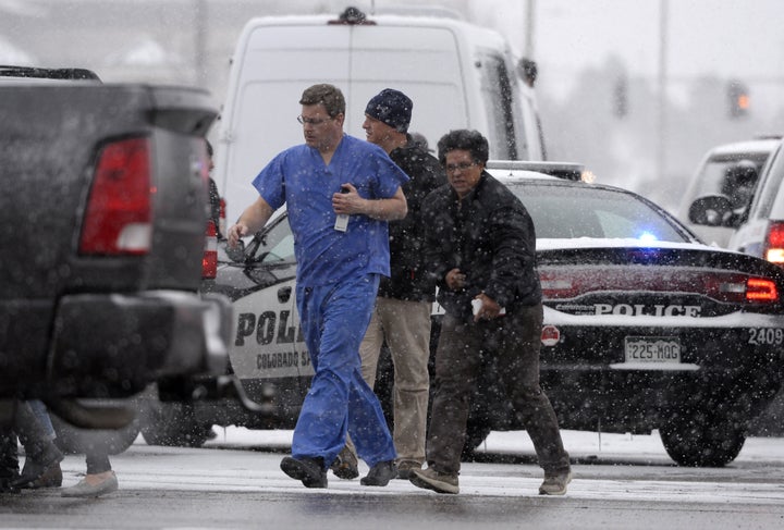 People are rescued near the scene of a shooting at the Planned Parenthood clinic in Colorado Springs, Colorado, on Nov. 27, 2