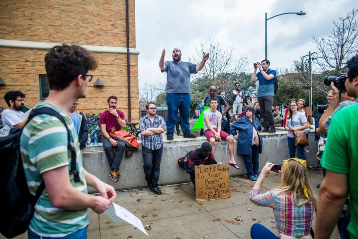 Protestors march at the site of a mock mass shooting close to the University of Texas campus in Austin.