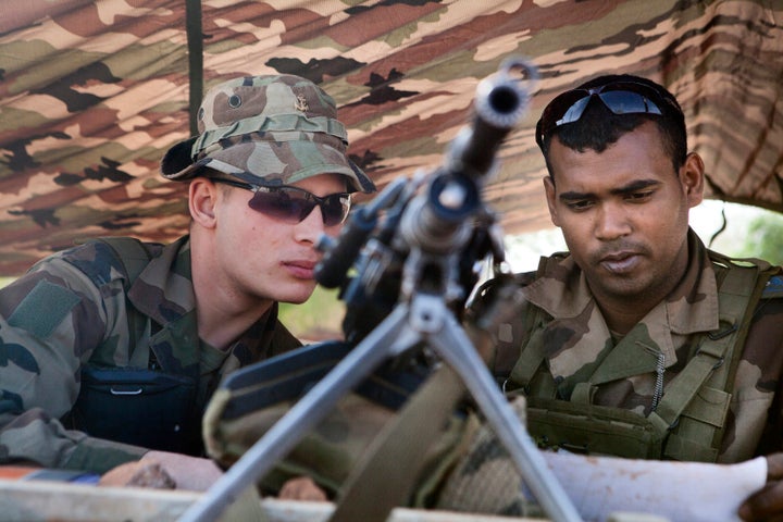French soldiers man a checkpoint at the French controlled area of the Bamako airport.