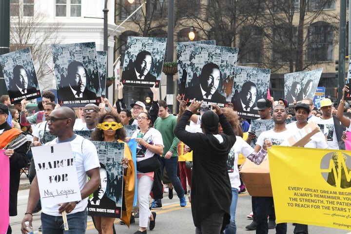 Marchers in Atlanta know whom the federal holiday honors on Monday: Martin Luther King Jr.