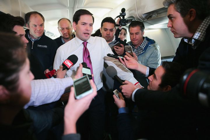 Republican presidential candidate Sen. Marco Rubio talks with reporters on his charter flight from Manchester-Boston Regional Airport to Spartanburg, South Carolina.