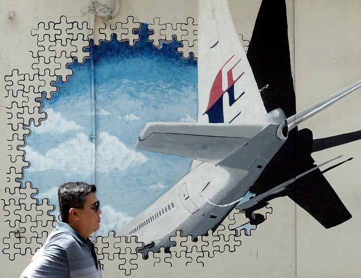 A mural of Malaysia Airlines Flight MH370 was painted on a back alley wall in Shah Alam, Malaysia. On Tuesday, the search for the doomed plane was called off.