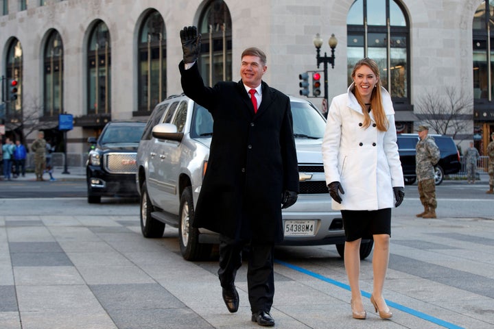 Army Sgt. Maj. Greg Lowery, left, and Army Spc. Sara Corry, stand in for the president-elect and his wife during a Sunday dress rehearsal for the inaugural parade.