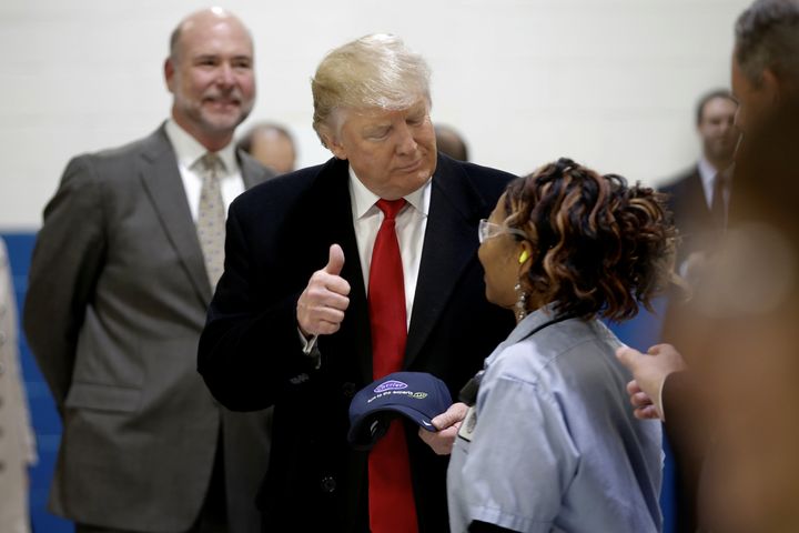 Trump stands with a worker from Carrier Corp. at a factory in Indianapolis. Dec. 1, 2016.