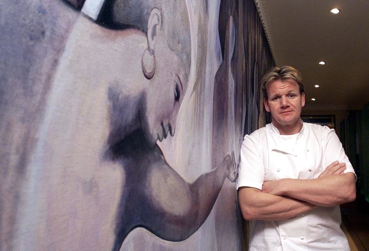 British Chef Gordon Ramsey stands at the entrance to his Chelsea restaurant in London in January 2001, after being awarded three Michelin stars. 