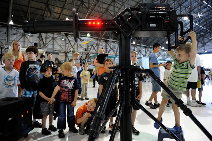 Geoffrey Boden, 4, tries out a laser gun while visiting "Star Wars at the Hanger" at Wings Over the Rockies Air & Space Museum in Denver, CO, May 04, 2012.