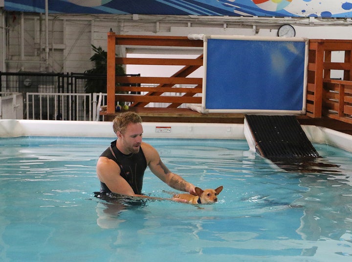 Casteel helps little Salem get used to the water.