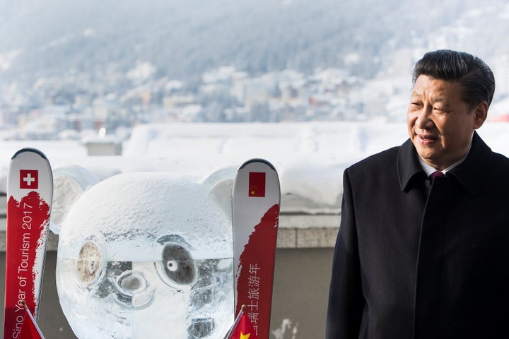 Chinese President Xi Jinping stands next to a panda ice sculpture as he launched the Swiss-Sino year of tourism with Swiss President Doris Leuthard on the sidelines of the World Economic Forum on Jan. 17, 2017.