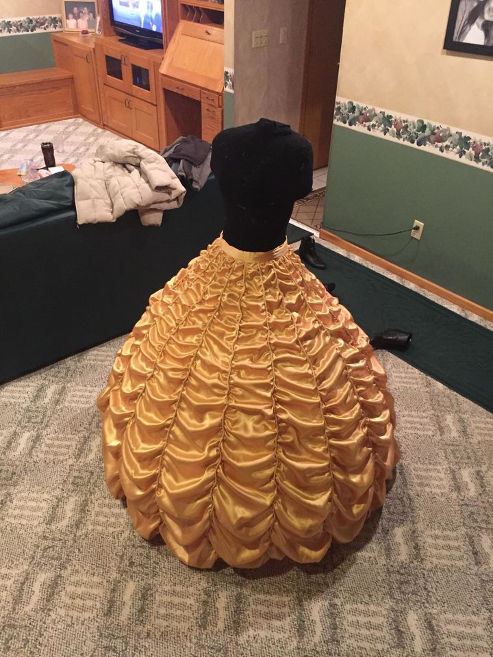 Joel used this <a href="http://tracyscostumingworld.weebly.com/belles-gold-ball-gown.html" target="_blank" role="link" class=" js-entry-link cet-external-link" data-vars-item-name="guide from Tracy&#x27;s Costuming World" data-vars-item-type="text" data-vars-unit-name="587e6c02e4b07b9dd705054e" data-vars-unit-type="buzz_body" data-vars-target-content-id="http://tracyscostumingworld.weebly.com/belles-gold-ball-gown.html" data-vars-target-content-type="url" data-vars-type="web_external_link" data-vars-subunit-name="article_body" data-vars-subunit-type="component" data-vars-position-in-subunit="3">guide from Tracy's Costuming World</a> as inspiration. 