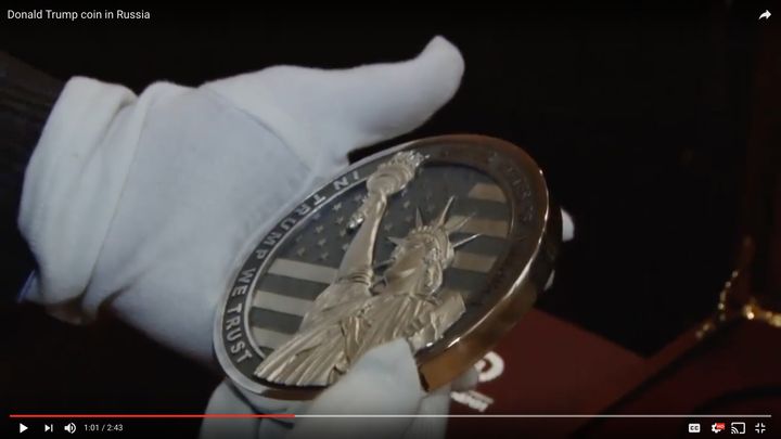 The coin's opposite side features the Statue of Liberty and the engraved line: "In Trump We Trust."