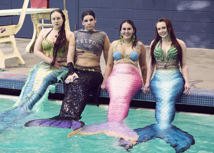 As members of Seattle’s mermaid community, Caitlin Nielsen, Ed Brown, Tessie LaMourea and Morgan Caldwell (L-R) get along swimmingly.