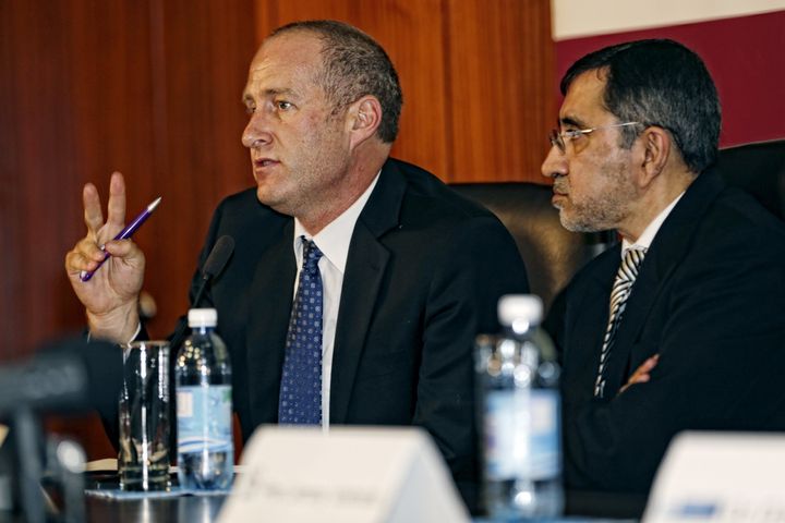 Professor Andre van der Merwe (L), head of the Stellenbosch University Division of Urology, and Professor Rafique Moosa (R), executive head of the department at the University of Stellenbosch, give a press conference at the Tygerberg Hospital in Bellville in Cape Town, on March 13, 2015, to announce that they had performed the world's first successful penis transplant, three months after the ground-breaking operation.