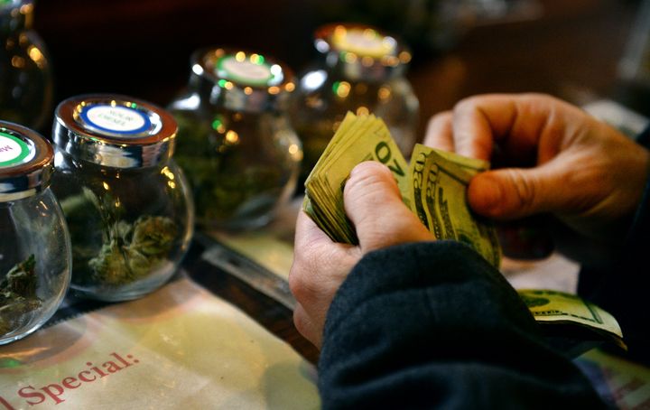 A customer purchases marijuana at a dispensary in Denver in 2014.