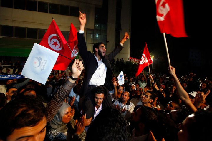 Supporters of the Islamist Ennahda movement celebrate after elections held in the wake of the Arab Spring in Tunisia