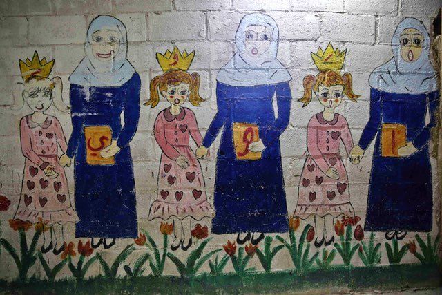 A mural in one of the underground rooms of the Al-Hayat school in Damascus' northeastern rebel-held al-Qaboun suburb.