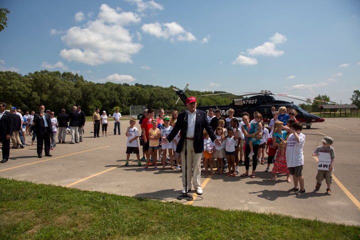 Republican presidential candidate Donald Trump speaks with reporters after arriving at the Iowa State Fair on August 15, 2015